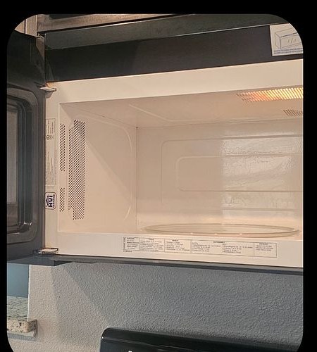 Microwave after cleaning — wiped clean and sanitized