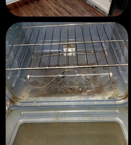 Oven interior before cleaning — burnt-on grease and food debris