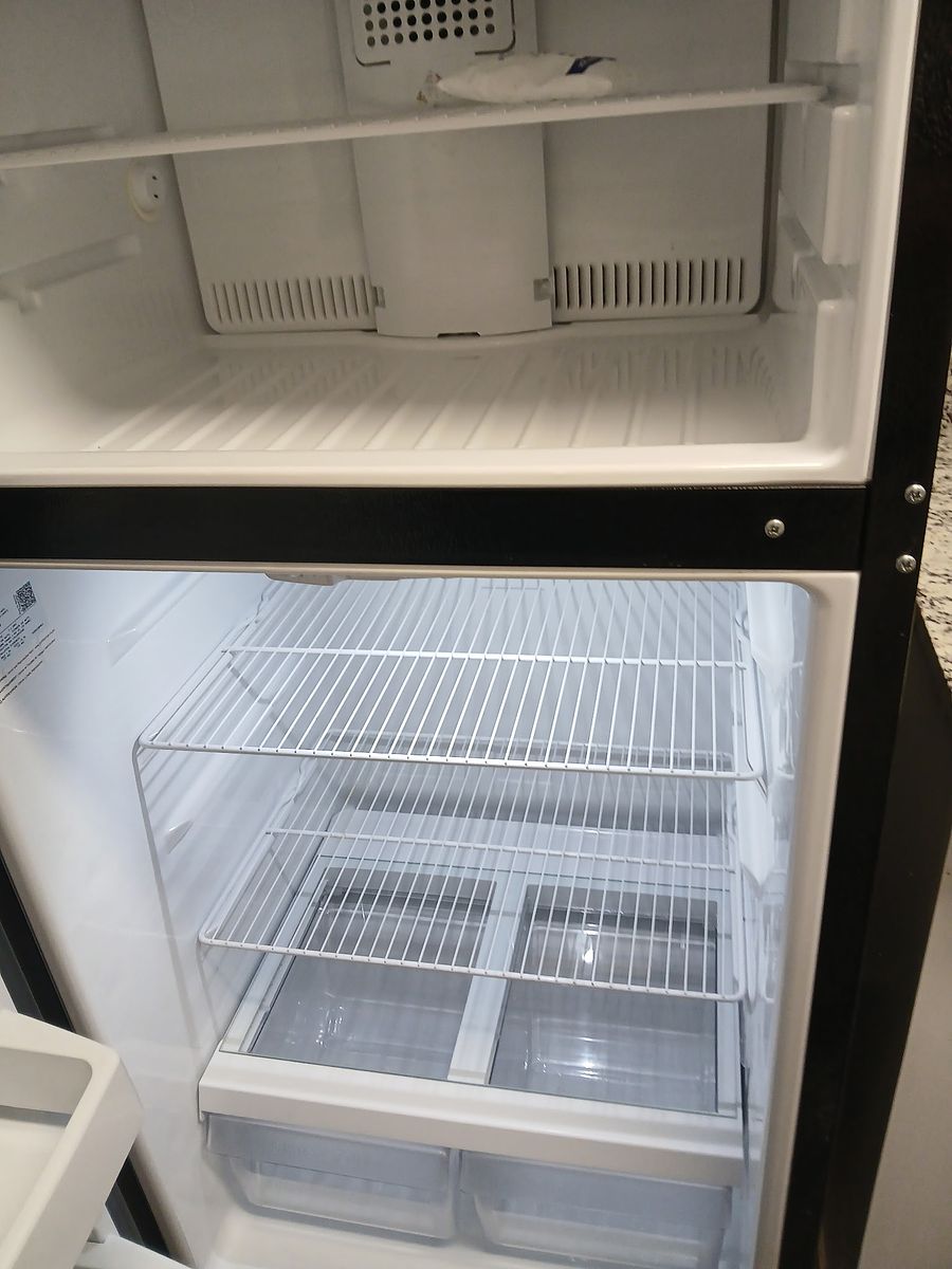 Refrigerator after cleaning — emptied, detailed, and deodorized