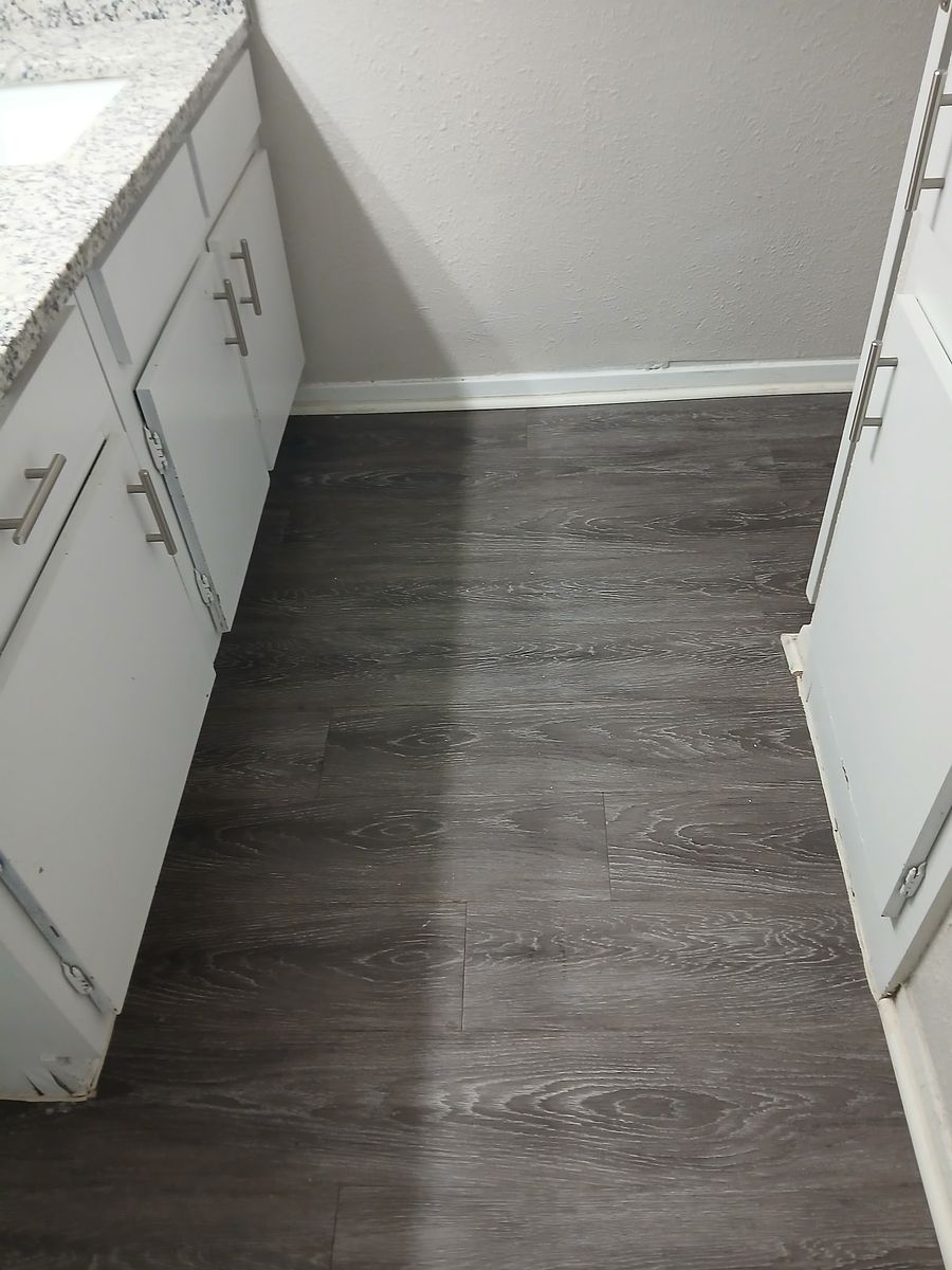 Kitchen before cleaning — counters and floors left dirty
