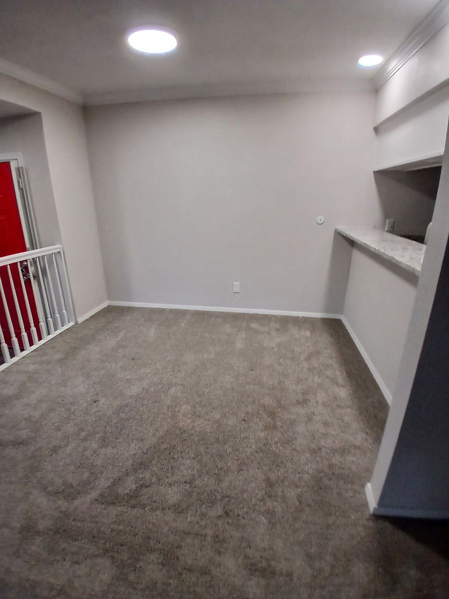 Room with red door after cleaning — reset and detailed