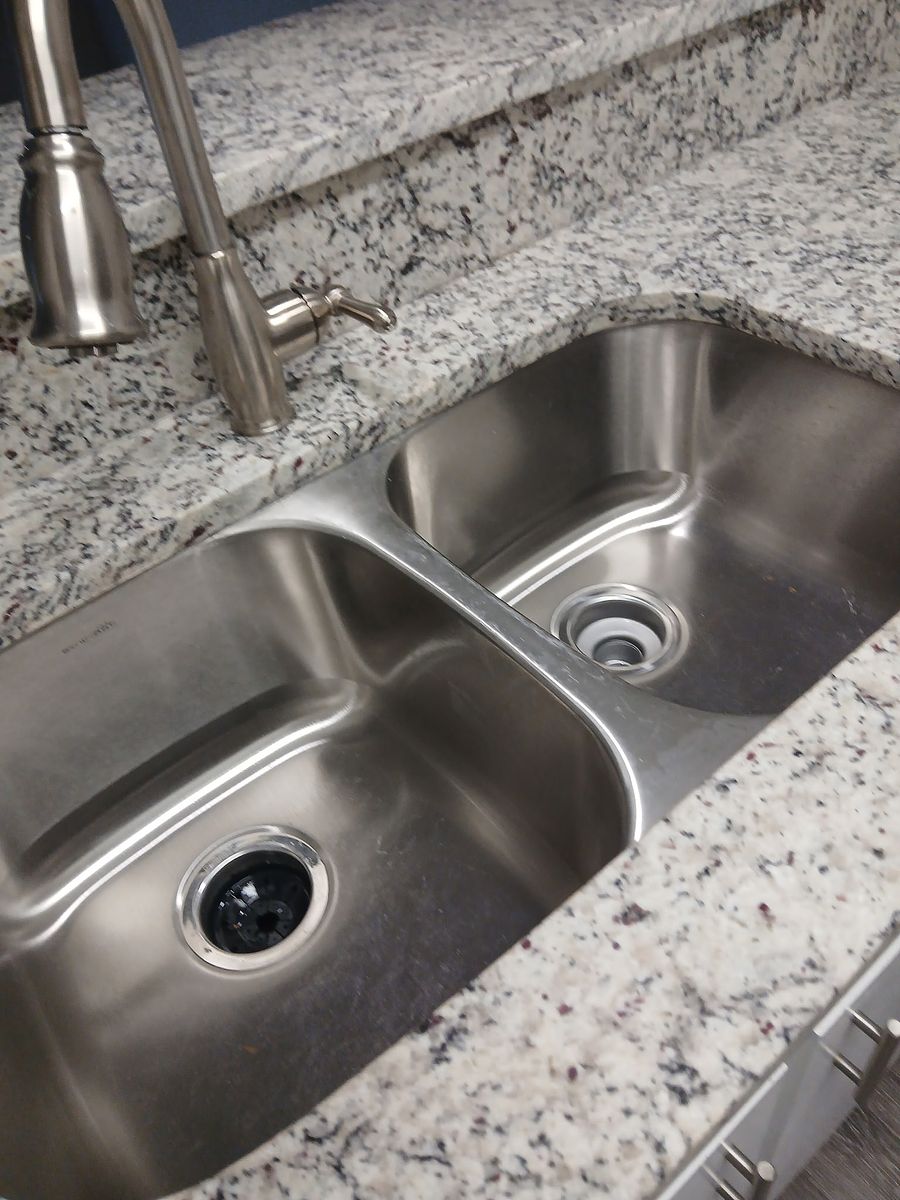 Kitchen sink after cleaning — descaled and polished