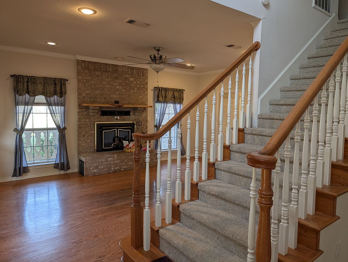 Living room with fireplace after cleaning — surround and mantel detailed