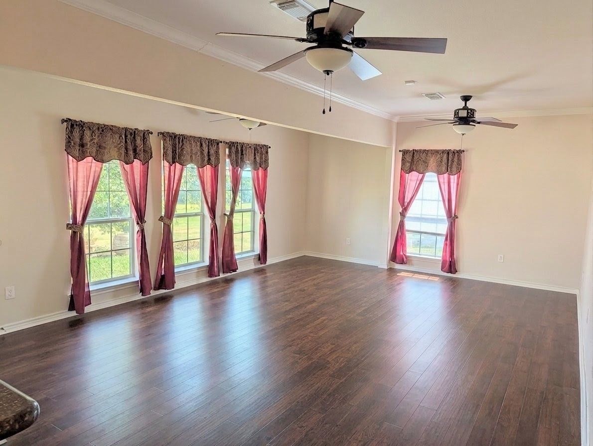 Great room after cleaning — floors, trim, and fixtures detailed