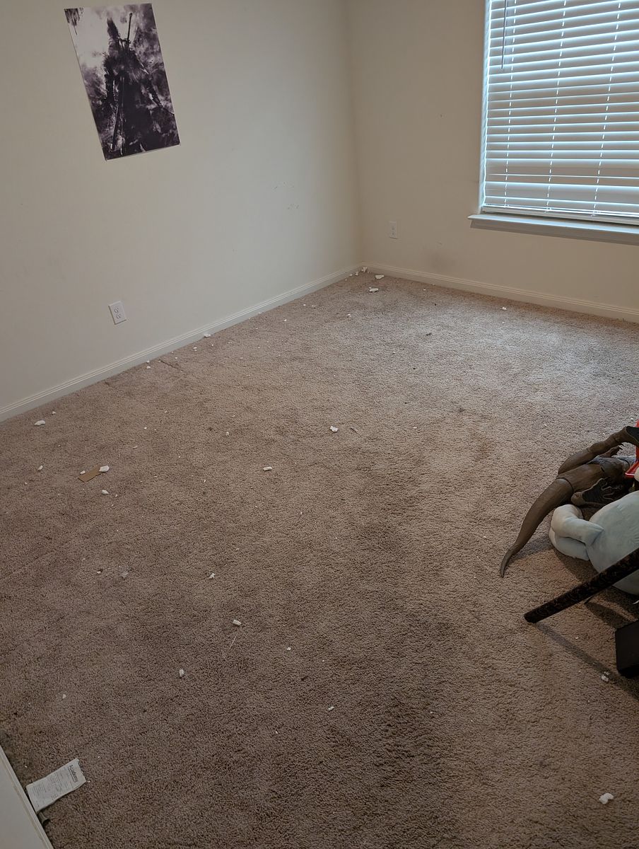 Bedroom before cleaning — floors and trim left dirty