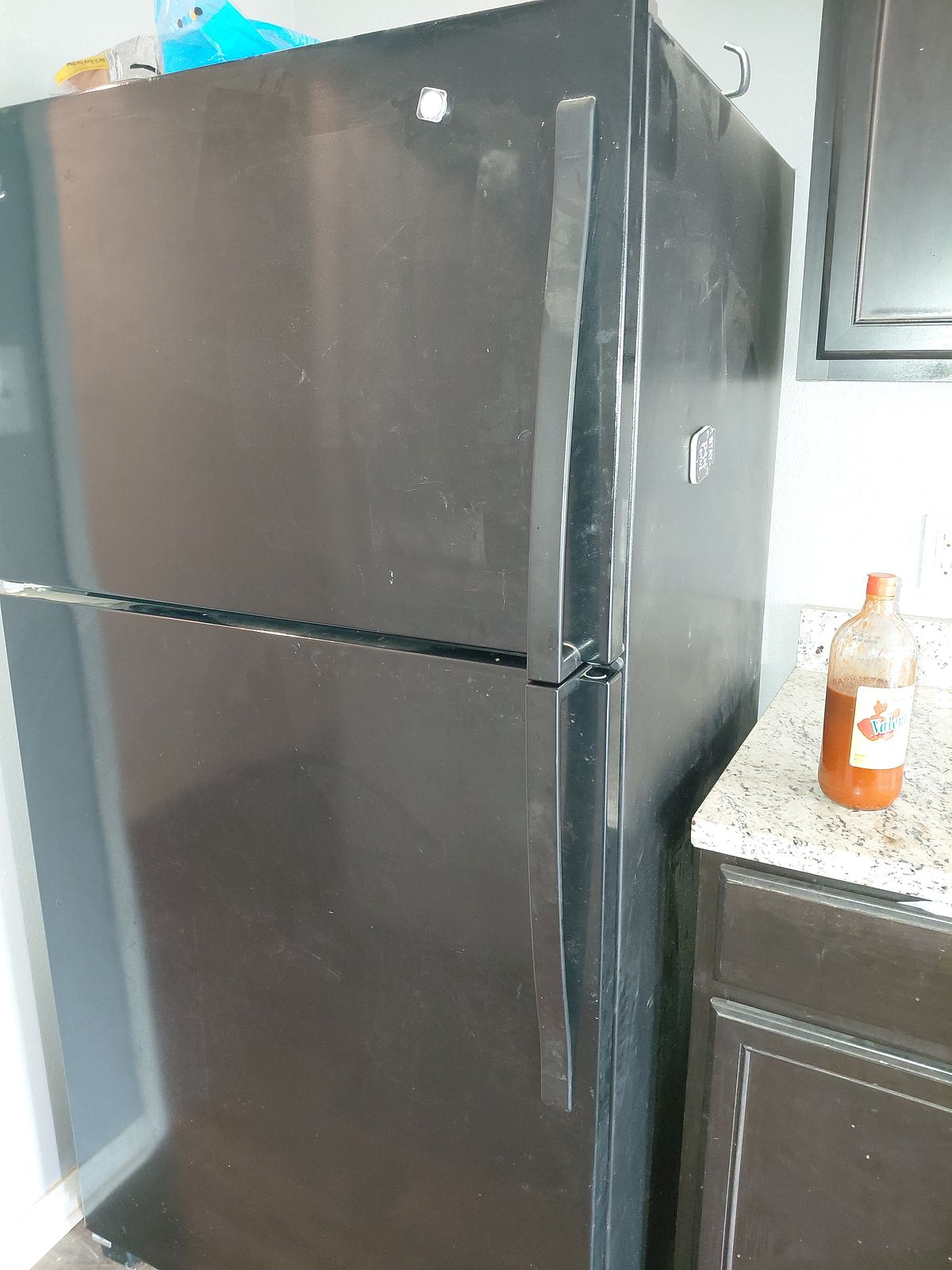 Kitchen before cleaning — counters and cabinets left dirty
