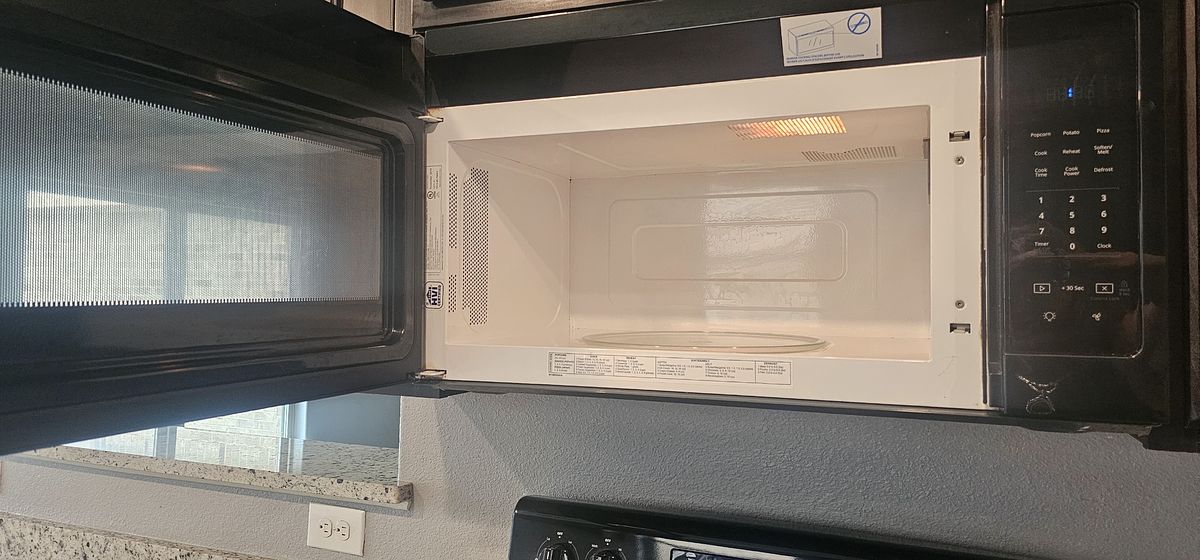 Microwave after cleaning — wiped clean and sanitized