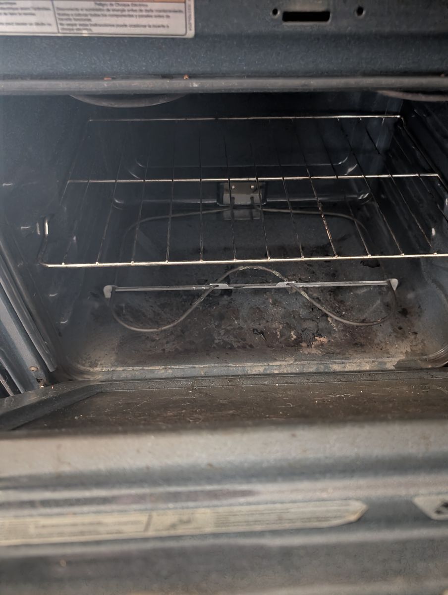 Range and oven before cleaning — grease and food debris